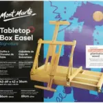 כן ציור שולחני ומזוודה